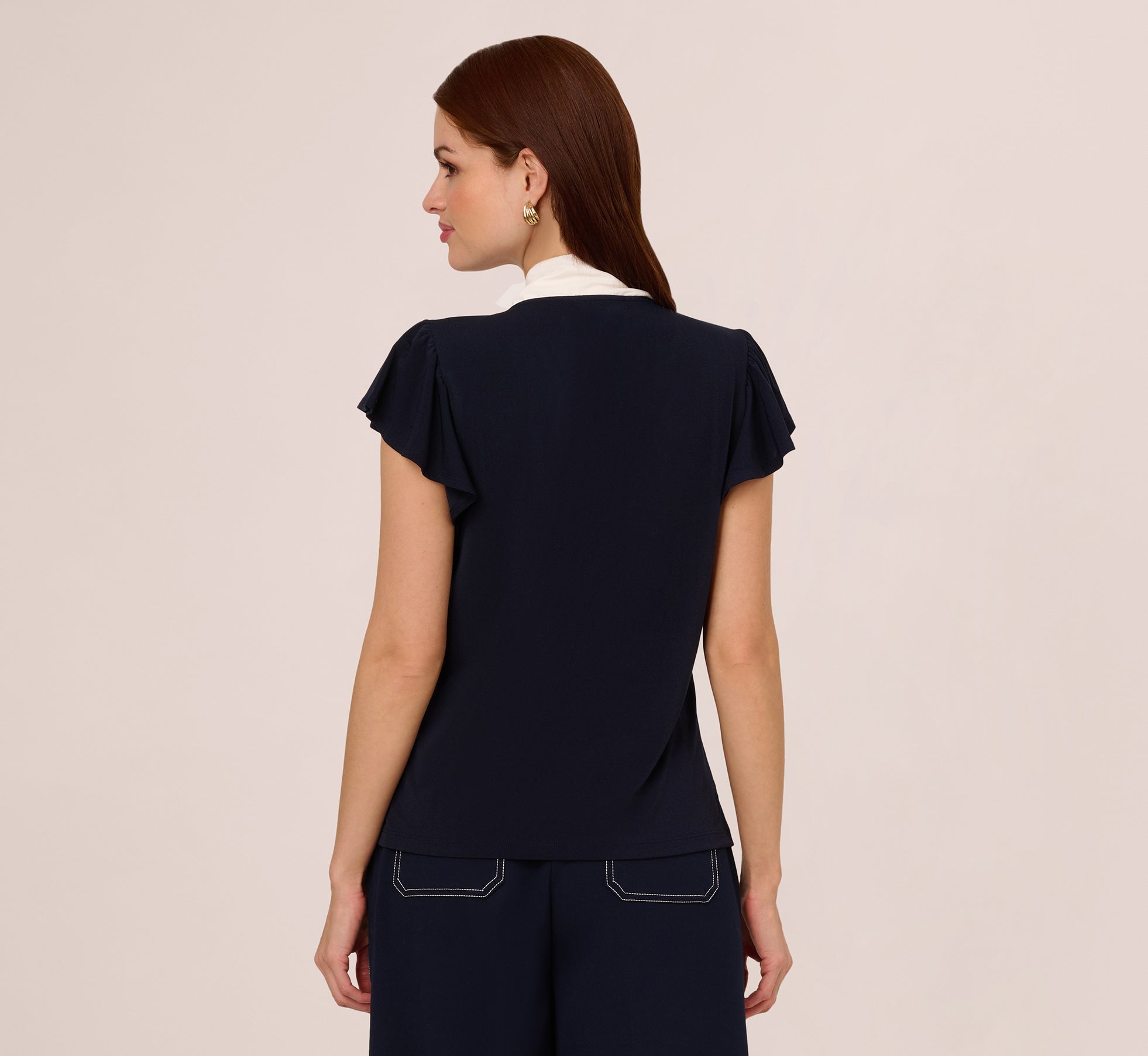 Flutter Sleeve Tie Neck Knit Top In Navy Ivory