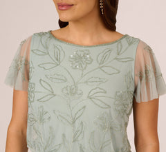 Plus Size Flutter Sleeve Floral Beaded Blouson Gown In Aqua Dust